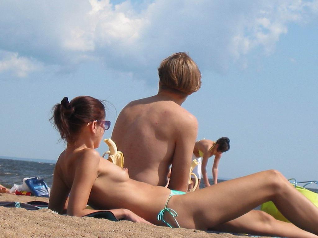 15P Gorgeous nude brunette with a nice ass sunbathes