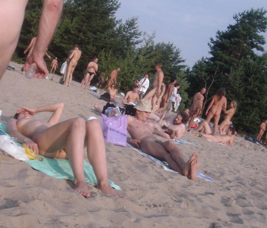15P Gorgeous nude brunette with a nice ass sunbathes