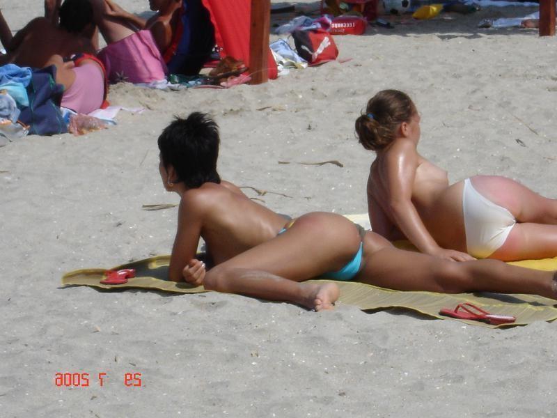 15P Hot Russian nudist strips her bikini off here