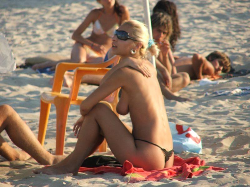15P Hot Russian nudist strips her bikini off here