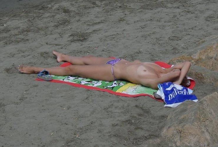 15P Hot Russian nudist strips her bikini off here