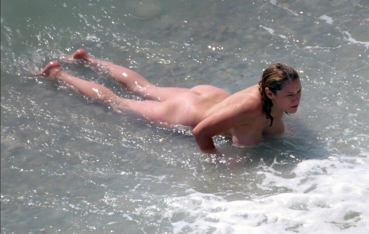 15P Wild naked chick has a great time at a nude beach