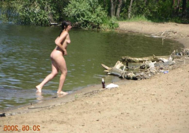 15P Wild naked chick has a great time at a nude beach