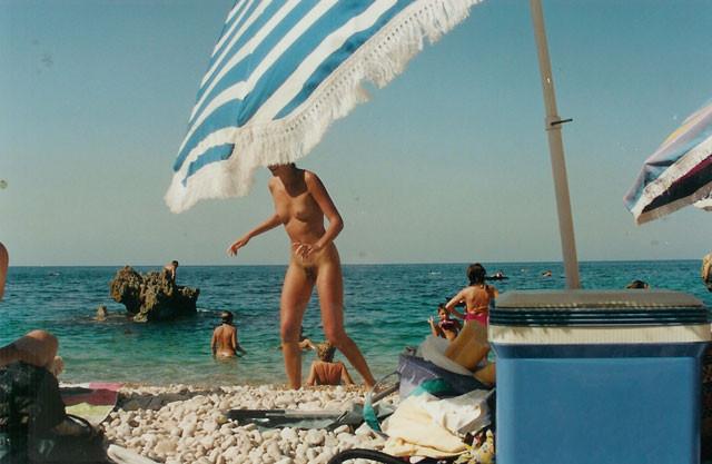 15P Barely legal nudist babe lights up at the beach