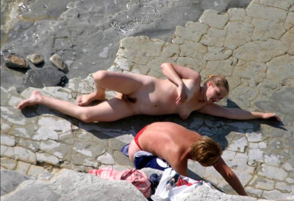 15P Watch a naked chick at the beach tan her hot body