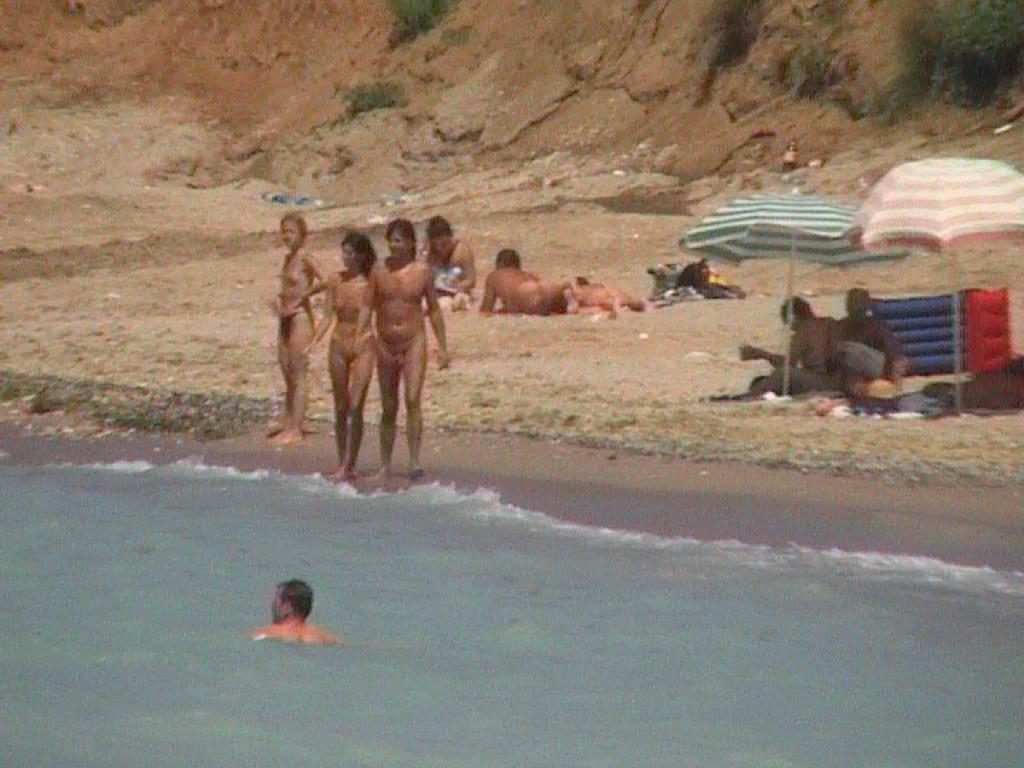15P Her sexy body gets a tan after she strips naked