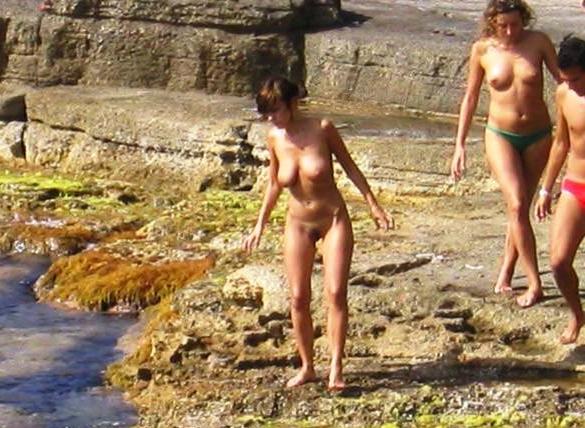 15P Watch this sexy blonde babe lay in the water naked