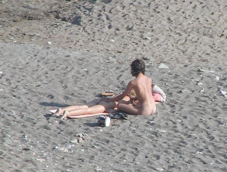 15P Watch this sexy blonde babe lay in the water naked