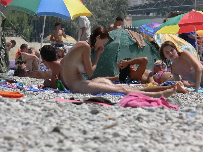 15P Blonde and brunette nude girls tanning outdoors
