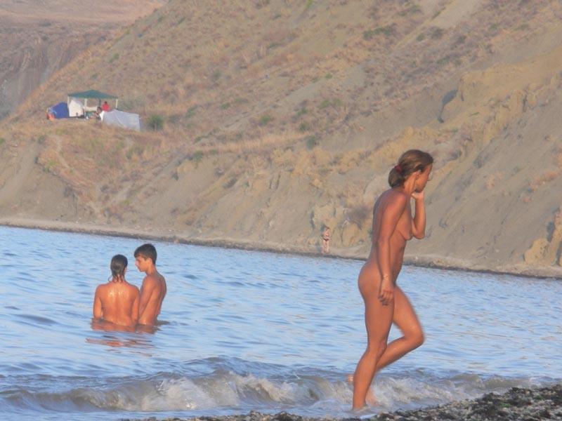 15P Brunette nudist loves feeling the sun on her body