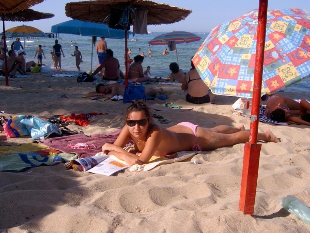 15P Slim nudist teen strips down to tan her nude body