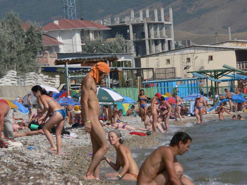 15P Barely legal nudist babe lights up at the beach