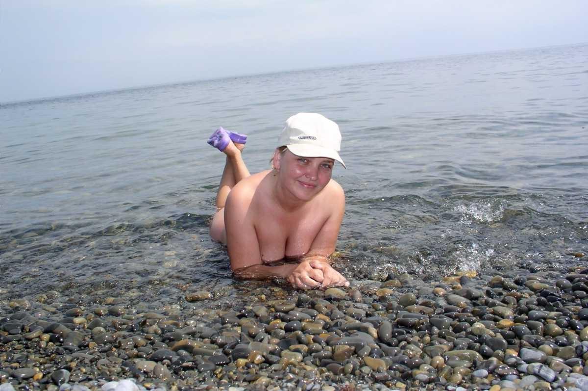 15P Barely legal nudist babe lights up at the beach