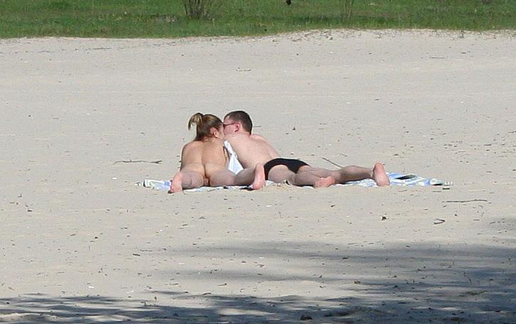 15P Barely legal nudist babe lights up at the beach