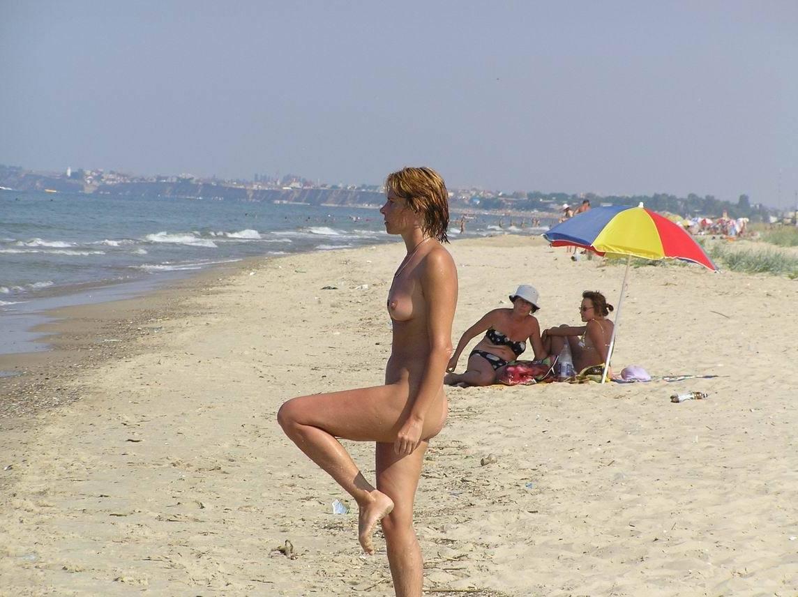 15P Hot Russian nudist strips her bikini off here