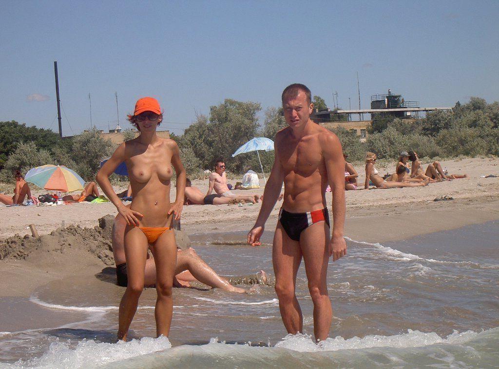 15P Watch the tits in the water from this nudist teen