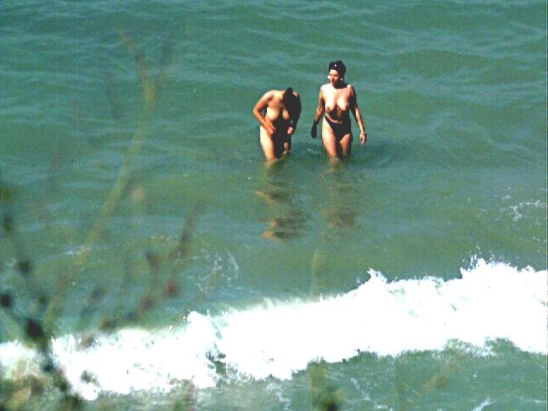 15P Watch the tits in the water from this nudist teen