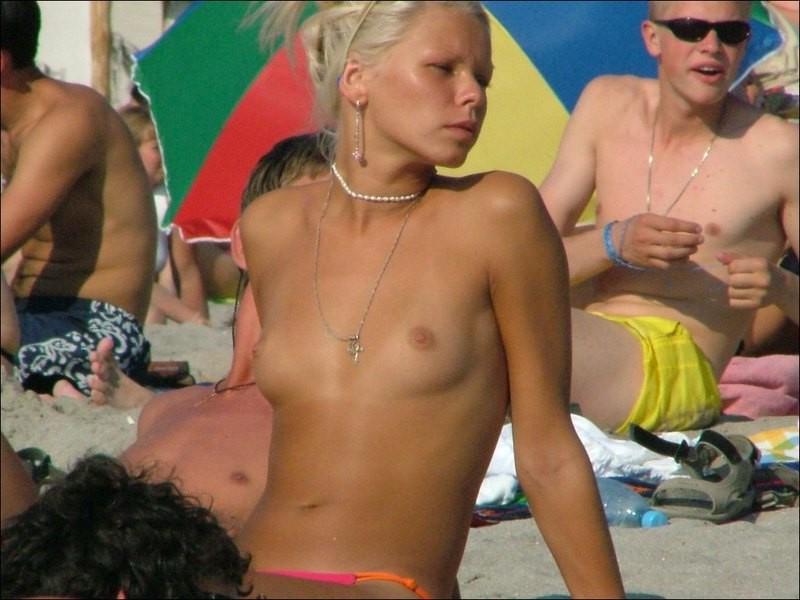 15P Watch the tits in the water from this nudist teen