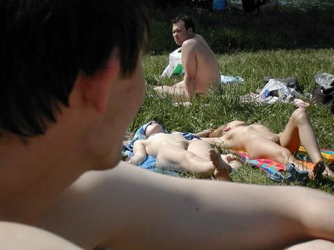 15P Watch a naked chick at the beach tan her hot body