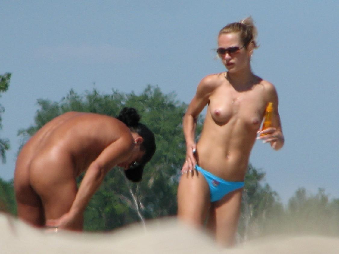 15P The water feels good on these nudist's bare skin