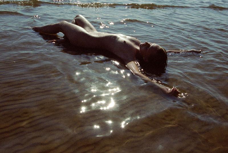 15P The water feels good on these nudist's bare skin