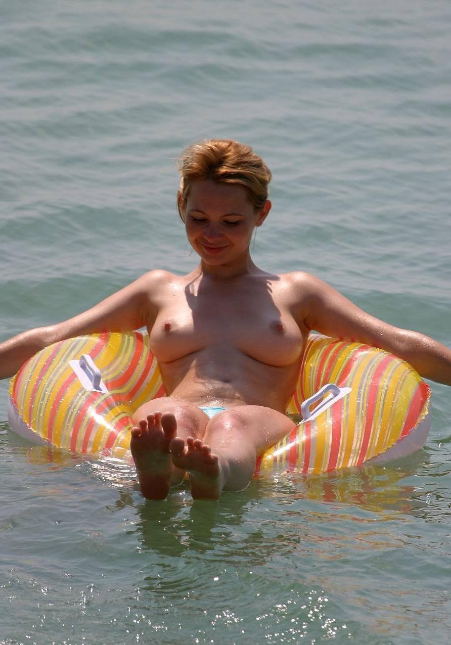 15P The water feels good on these nudist's bare skin