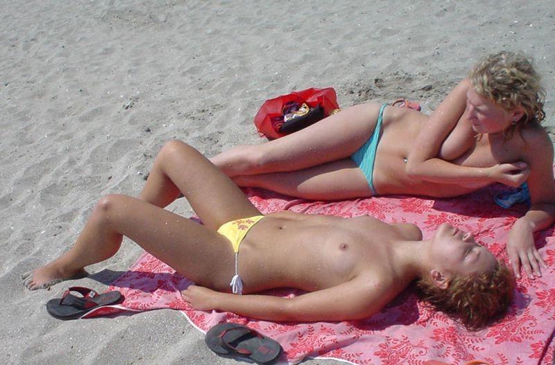 15P The sand's not nearly as hot as these two nudists