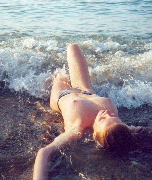 15P Big breasted blonde Russian nudist sunbathes naked