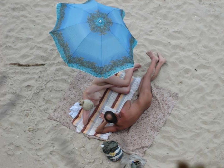 15P Tanning nude hottie exposes her perfect sexy body