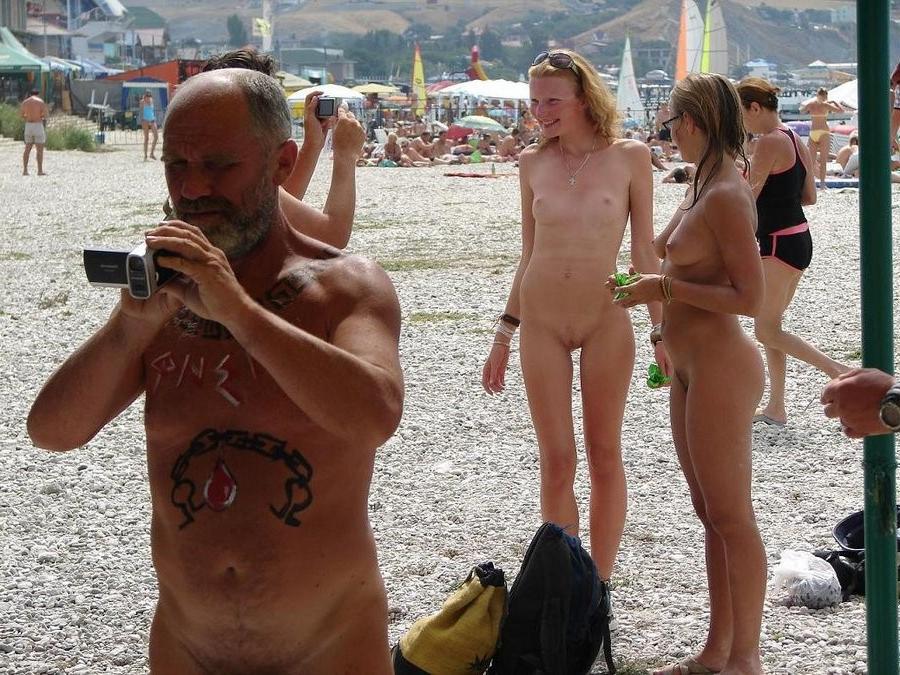 15P Big breasted blonde Russian nudist sunbathes naked