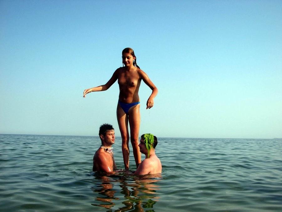 15P Hot Russian nudist strips her bikini off here