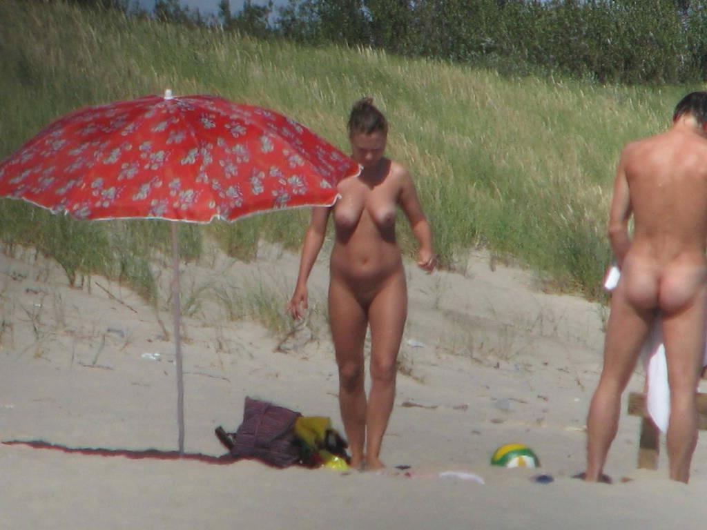 15P Hot Russian nudist strips her bikini off here