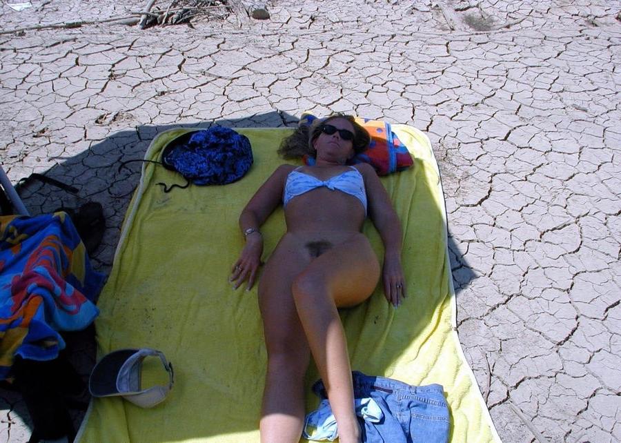 15P Blonde and brunette nude girls tanning outdoors