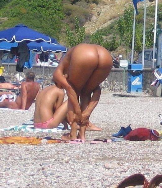 15P Sexy teen shocks the beach when she strips nude