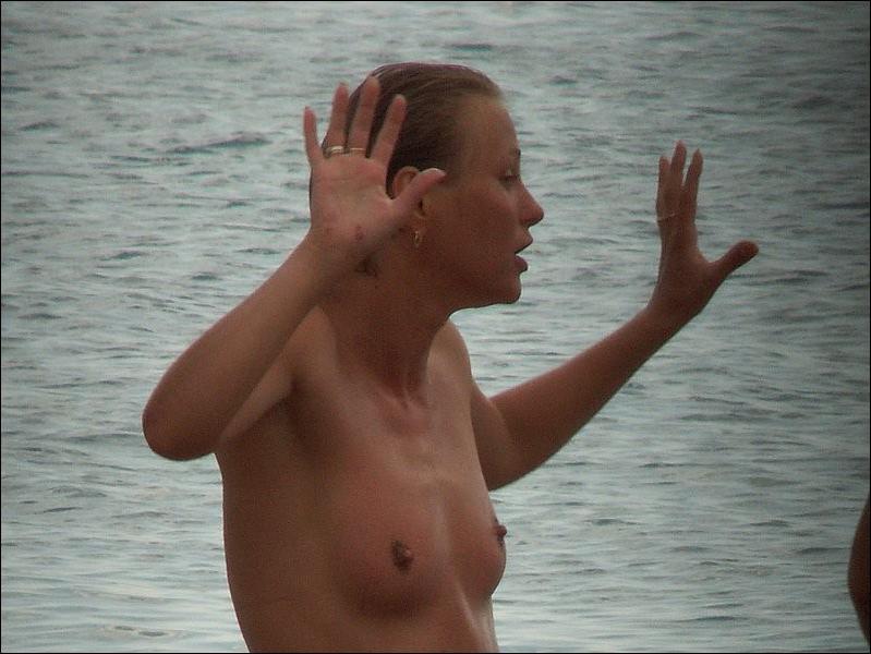 15P Naked lovers slyly filmed having sex fun in the sea