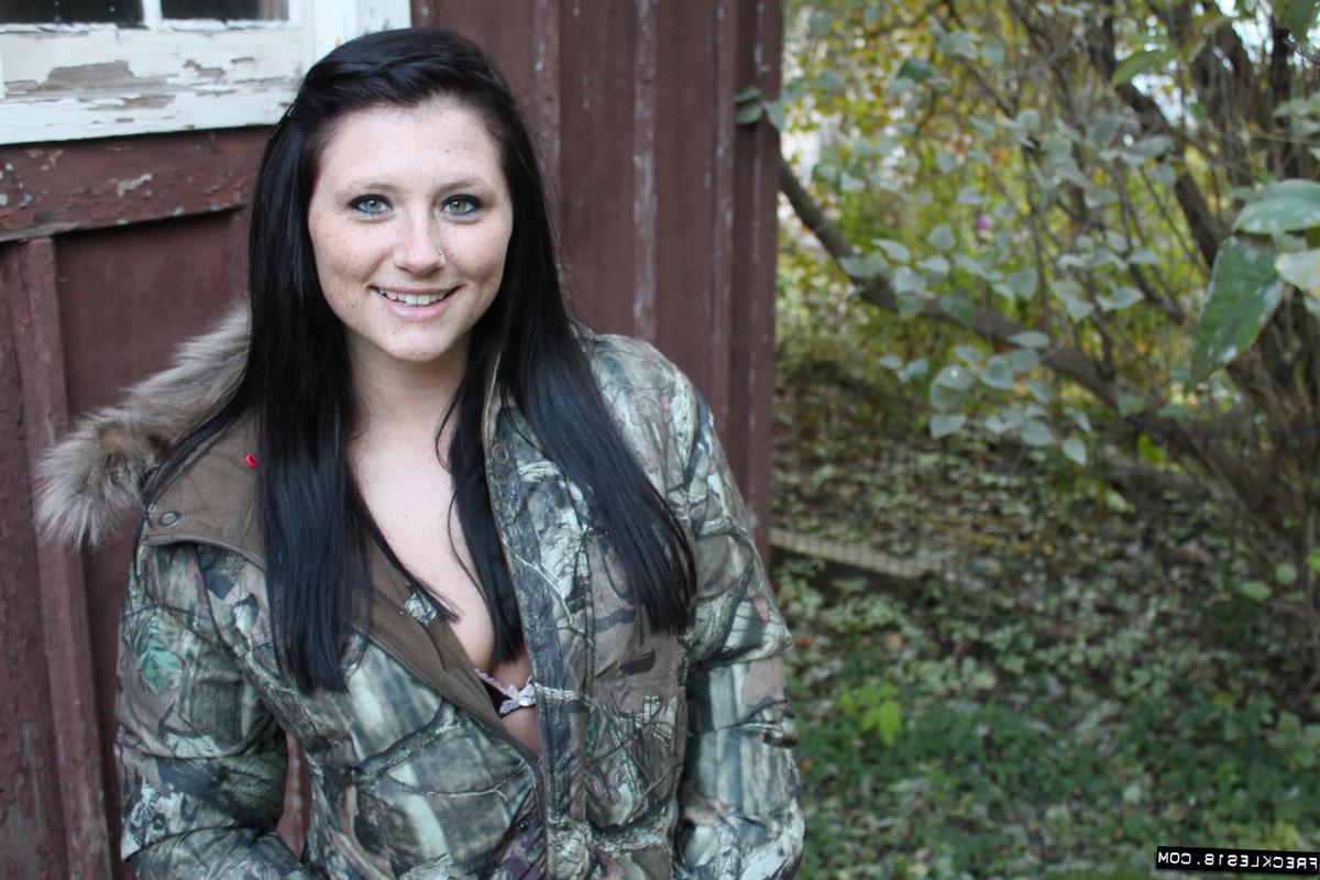 12P Stunning teen Freckles teases outside in a camo jacket