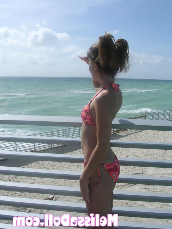15P Melissa peels back her bikini and shows a pink plump pussy