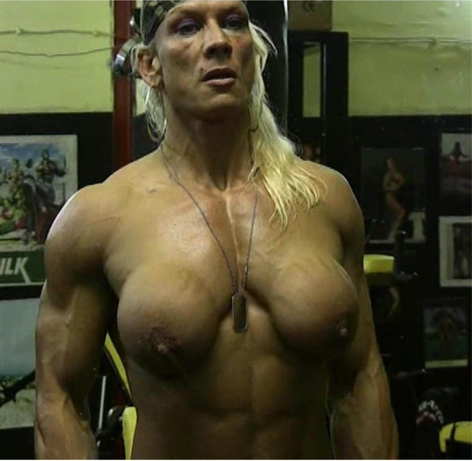 15P female bodybuilder showing off her muscles