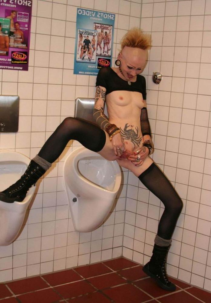 16P extreme pierced and tattoo babe pee in the toilet