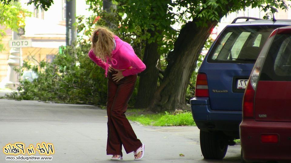 12P Nasty babe pee-soaks her sexy crimson pants behind a car in the yard