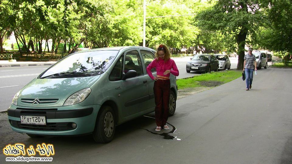 12P Nasty babe pee-soaks her sexy crimson pants behind a car in the yard