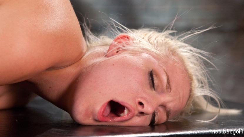 15P In walks this blond bombshell that looks like Marilyn Monroe, dressed in a red d