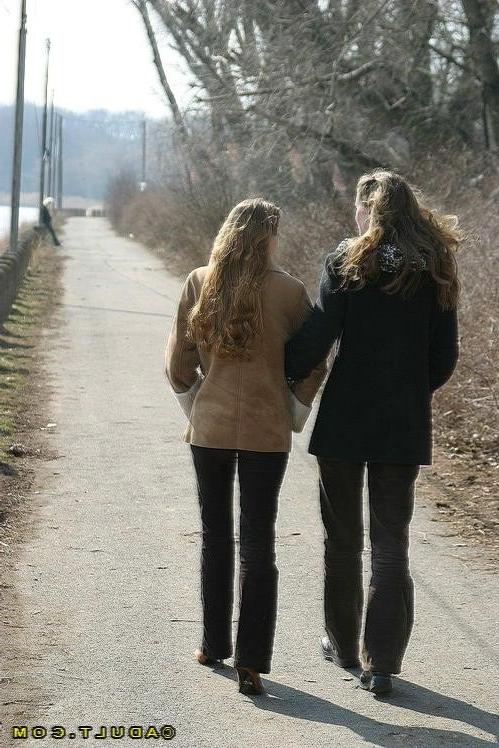 16P Three cute playful lesbians walking in the park