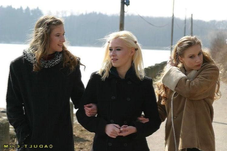 16P Three cute playful lesbians walking in the park