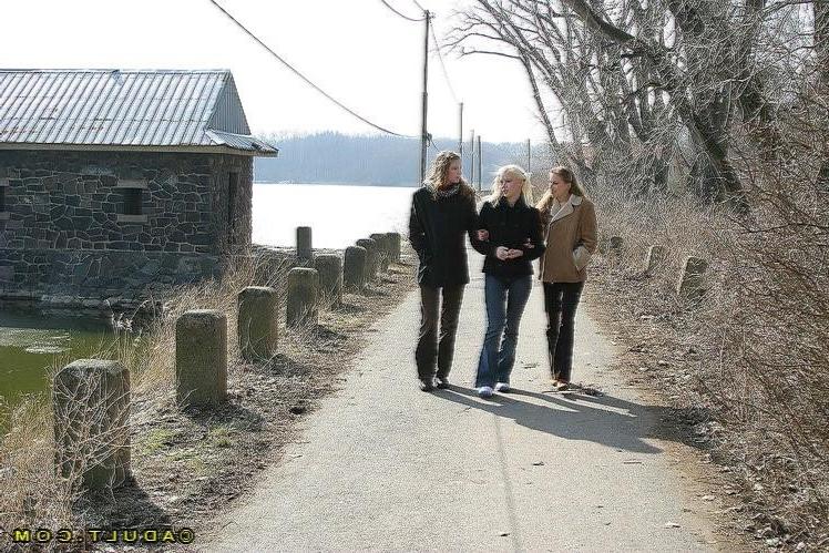 16P Three cute playful lesbians walking in the park
