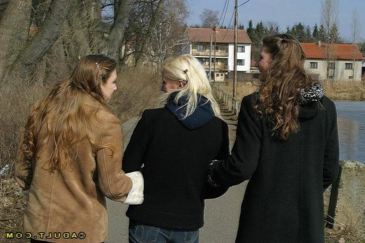 16P Three cute playful lesbians walking in the park