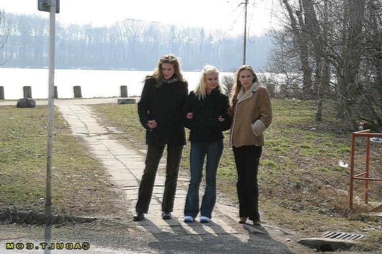 16P Three cute playful lesbians walking in the park
