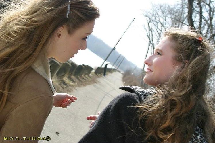 16P Three cute playful lesbians walking in the park