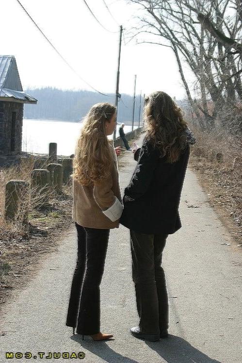 16P Three cute playful lesbians walking in the park