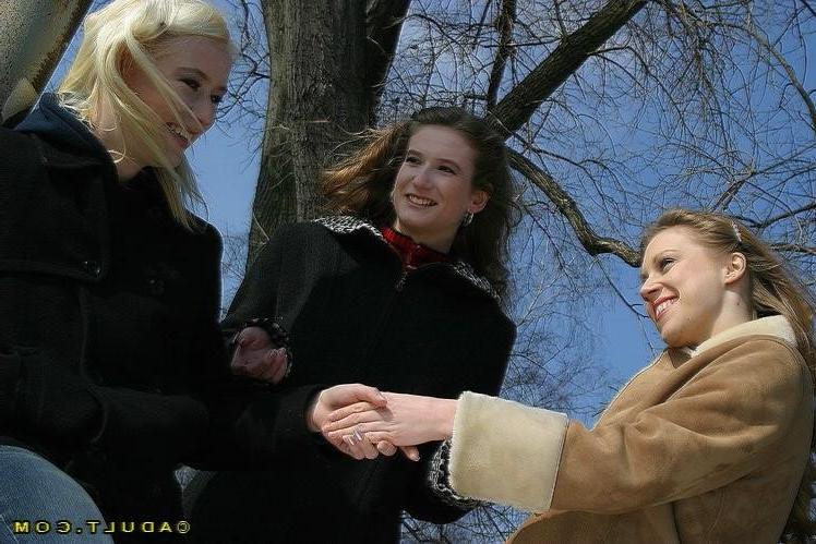16P Three cute playful lesbians walking in the park
